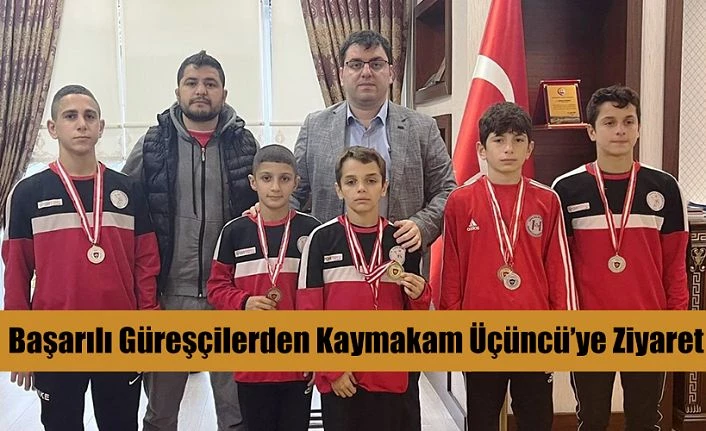 BAŞARILI GÜREŞÇİLERİNDEN KAYMAKAM ÜÇÜNCÜ’YE ZİYARET