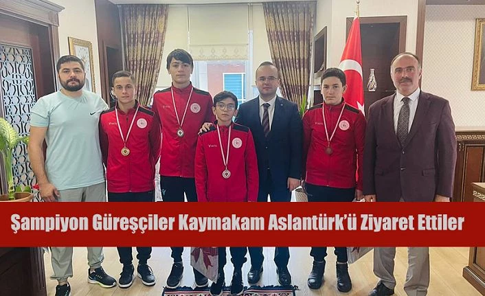 ŞAMPİYON GÜREŞÇİLERDEN KAYMAKAM ARSLANTÜRKE ZİYARET
